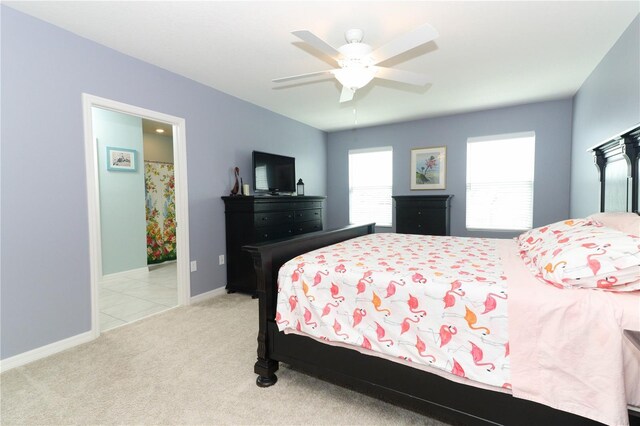 bedroom with light carpet and ceiling fan