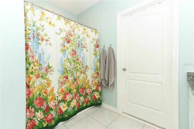 bathroom with tile patterned floors