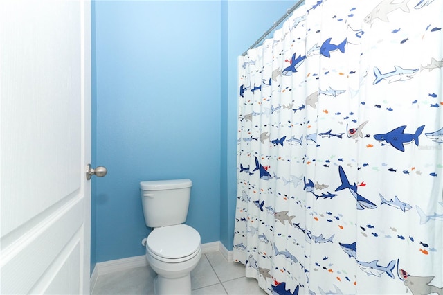 bathroom with tile patterned floors and toilet