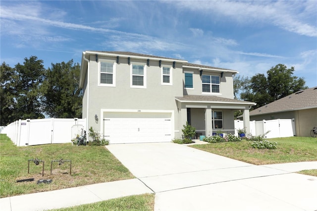 view of front of property with a garage and a front lawn