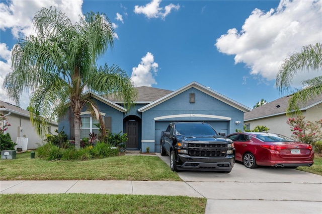 view of front of home with a front lawn and a garage