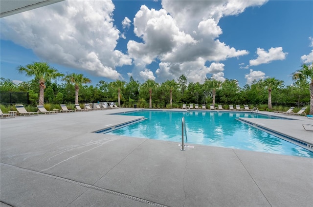 view of pool featuring a patio