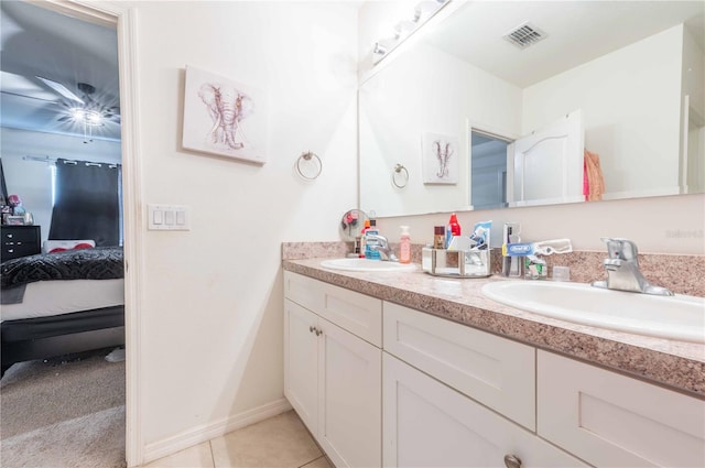 bathroom featuring dual bowl vanity and tile patterned floors