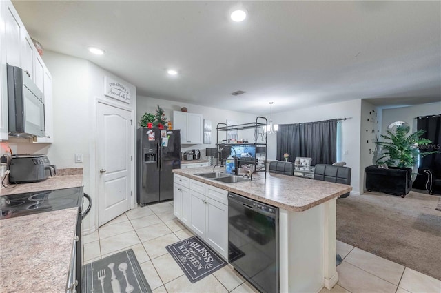 kitchen featuring light tile patterned floors, white cabinets, a center island with sink, sink, and black appliances