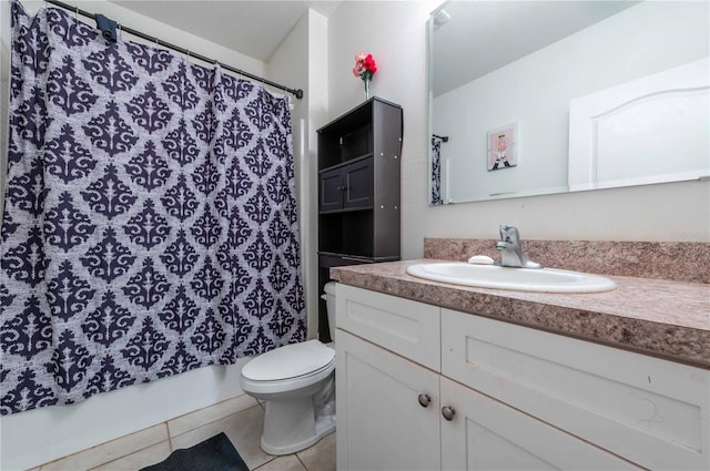 full bathroom featuring tile patterned floors, shower / tub combo, vanity, and toilet