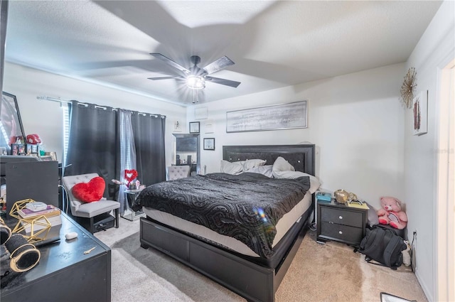 bedroom with light carpet and ceiling fan