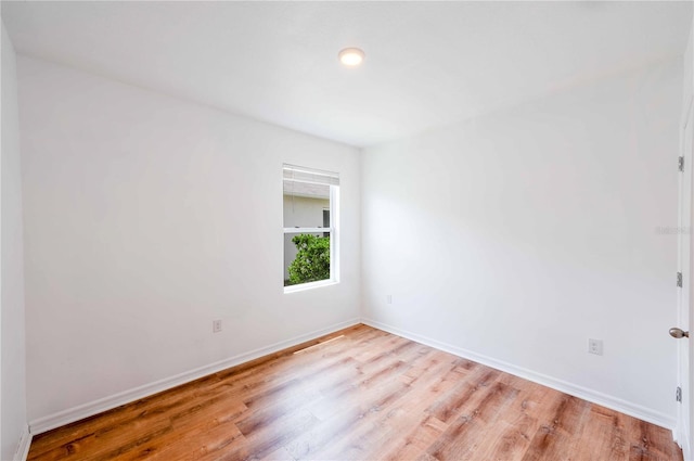 2950 Gibraltar Blvd, New Smyrna Beach, FL 32168 - empty room featuring baseboards and light wood-style floors