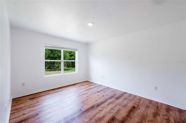 2950 Gibraltar Blvd, New Smyrna Beach, FL 32168 - unfurnished room featuring baseboards and wood finished floors