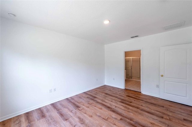2950 Gibraltar Blvd, New Smyrna Beach, FL 32168 - empty room featuring baseboards, wood finished floors, visible vents, and recessed lighting