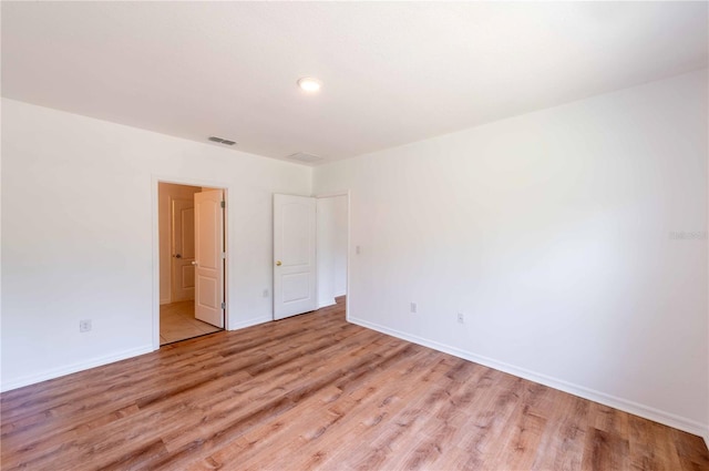 2950 Gibraltar Blvd, New Smyrna Beach, FL 32168 - unfurnished bedroom featuring light wood-style floors, visible vents, and baseboards