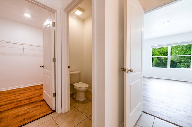 2950 Gibraltar Blvd, New Smyrna Beach, FL 32168 - bathroom featuring baseboards, tile patterned flooring, and toilet