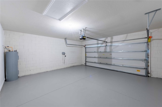 2950 Gibraltar Blvd, New Smyrna Beach, FL 32168 - garage featuring water heater, concrete block wall, and a garage door opener