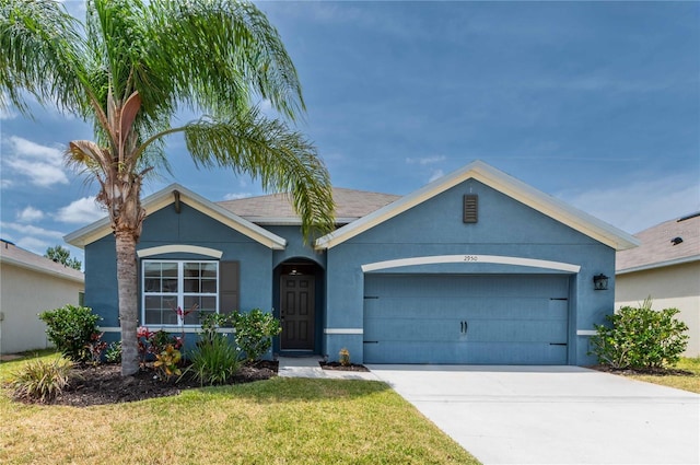 2950 Gibraltar Blvd, New Smyrna Beach, FL 32168 - single story home with an attached garage, stucco siding, a front yard, and concrete driveway