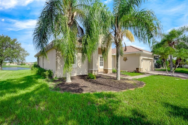 exterior space with a garage and a front lawn