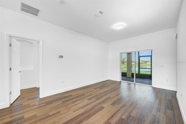 unfurnished room with dark hardwood / wood-style floors