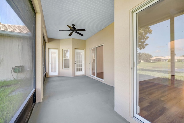 sunroom with ceiling fan and a wealth of natural light