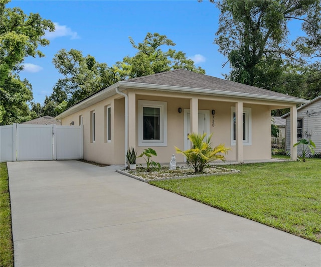 view of front of home with a porch and a front lawn