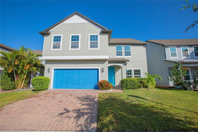 view of front of house with a garage and a front yard