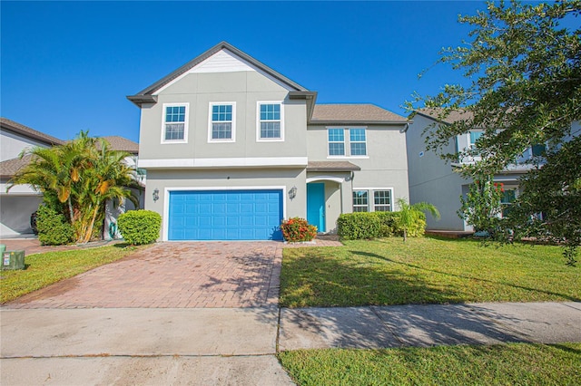 view of front of house featuring a garage and a front yard