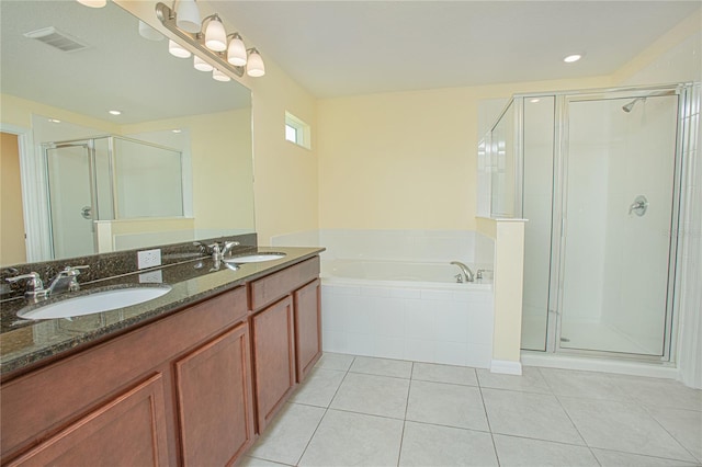 bathroom featuring vanity, tile patterned floors, and independent shower and bath