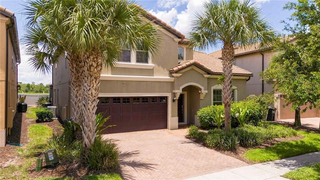 mediterranean / spanish-style house featuring a garage