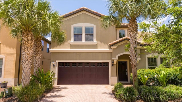 mediterranean / spanish-style home featuring a garage