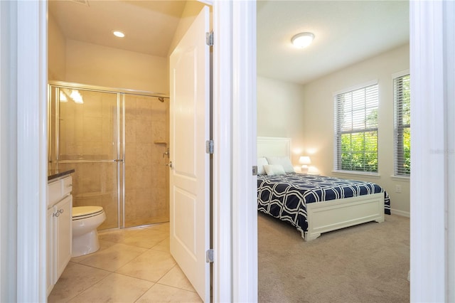 carpeted bedroom with ensuite bath