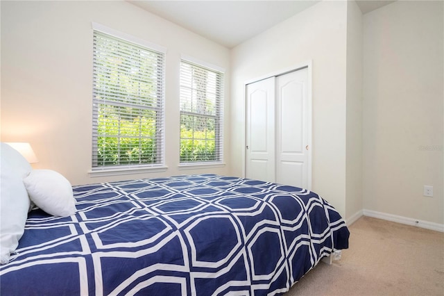 carpeted bedroom featuring a closet