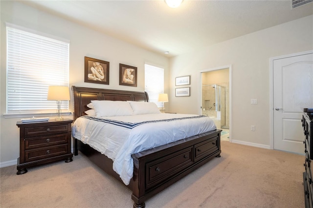 carpeted bedroom with connected bathroom