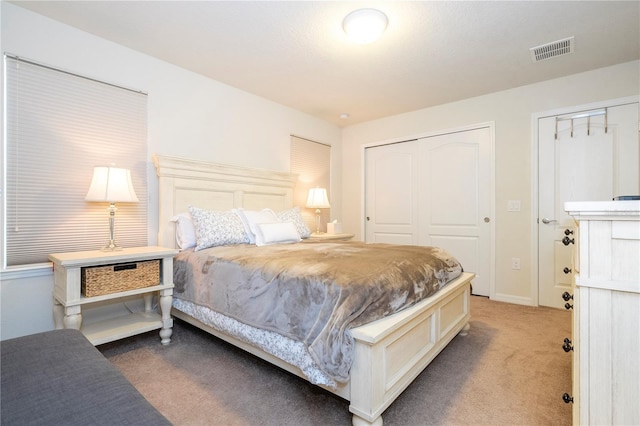 bedroom featuring two closets and carpet flooring