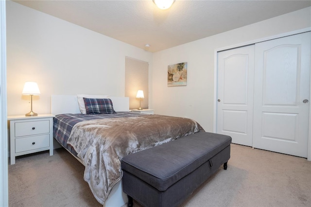 carpeted bedroom with a closet