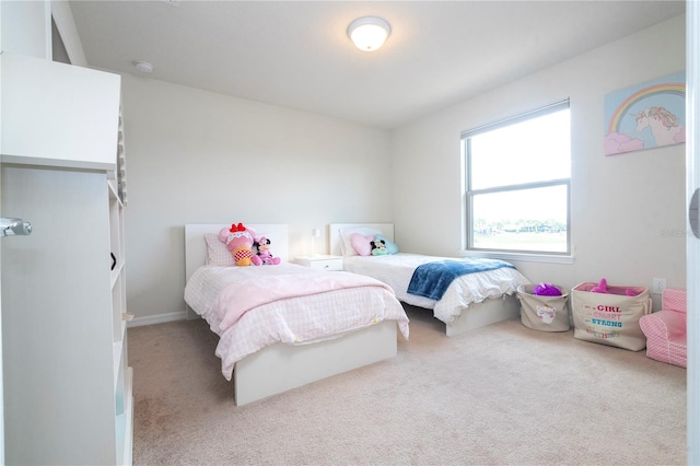 bedroom featuring light colored carpet