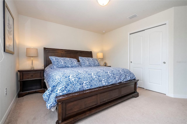 carpeted bedroom featuring a closet