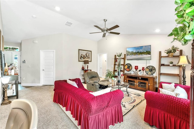 living room with vaulted ceiling, carpet floors, and ceiling fan