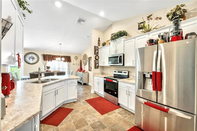 kitchen with stainless steel appliances, hanging light fixtures, sink, vaulted ceiling, and light tile patterned floors