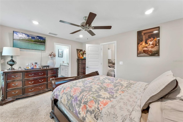 carpeted bedroom featuring connected bathroom and ceiling fan