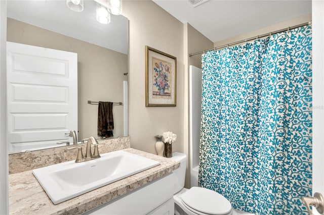 full bathroom featuring vanity, shower / bath combo, and toilet