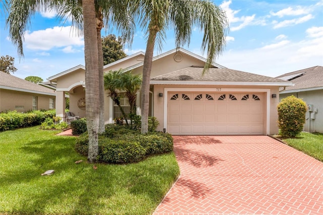 ranch-style house with a front lawn and a garage