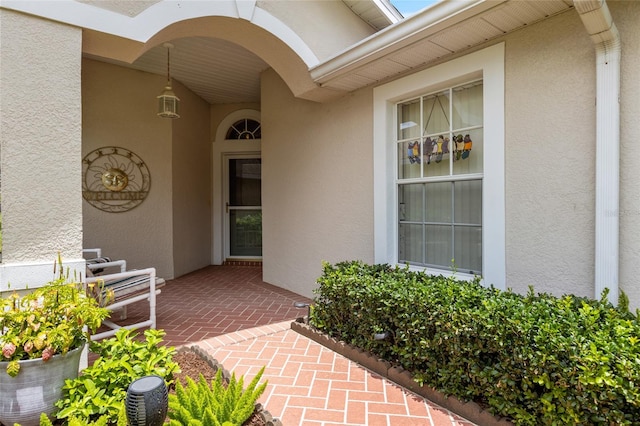 entrance to property with a patio area