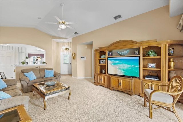 carpeted living room featuring ceiling fan and vaulted ceiling