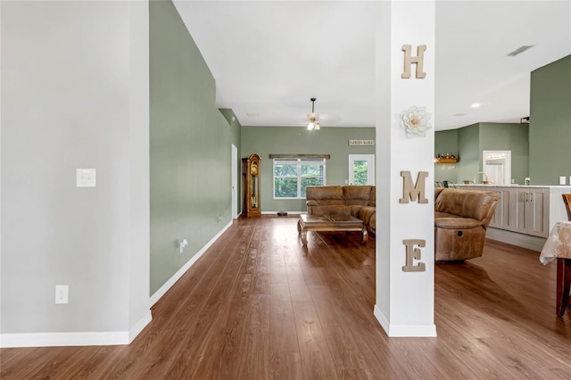 unfurnished living room with hardwood / wood-style flooring