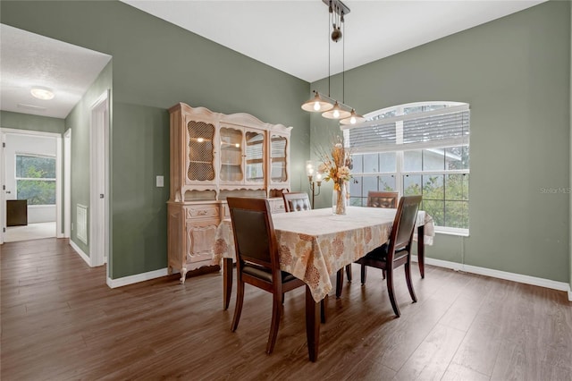 dining area featuring dark hardwood / wood-style flooring