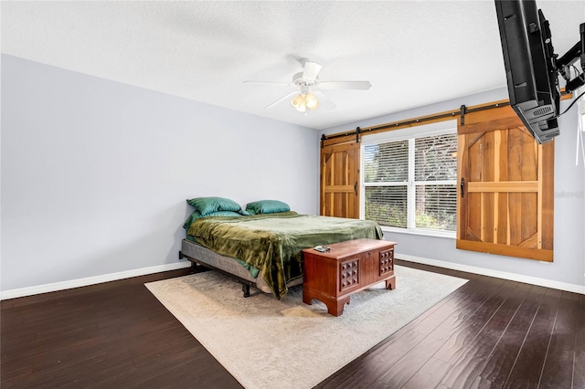 bedroom with hardwood / wood-style flooring and ceiling fan