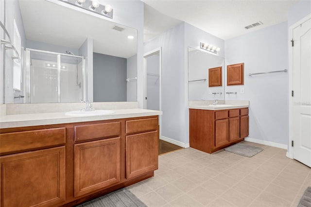 bathroom featuring vanity and walk in shower