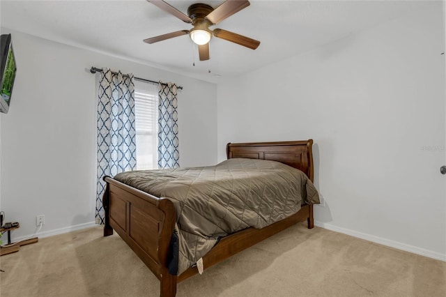 bedroom featuring ceiling fan and light colored carpet