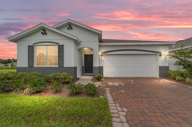 single story home featuring a garage