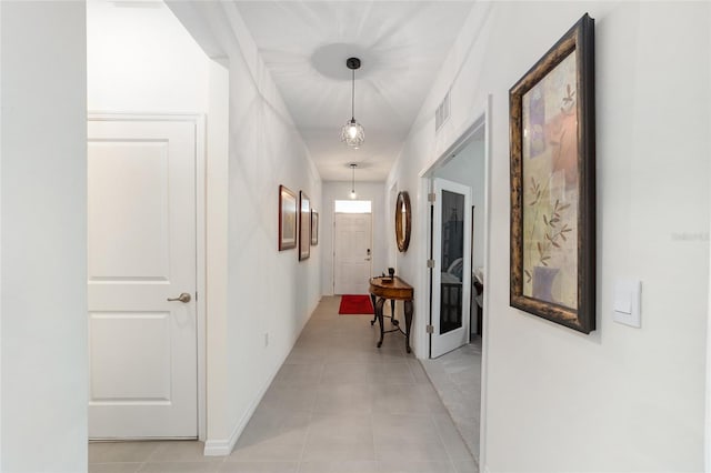 hallway with light tile patterned flooring