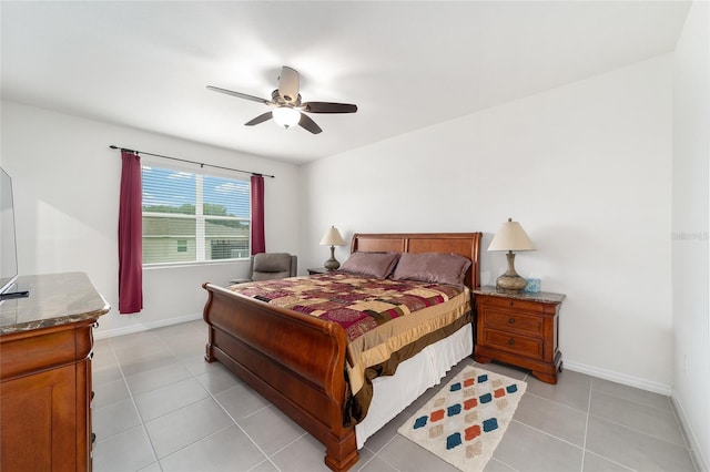 bedroom featuring light tile patterned floors and ceiling fan