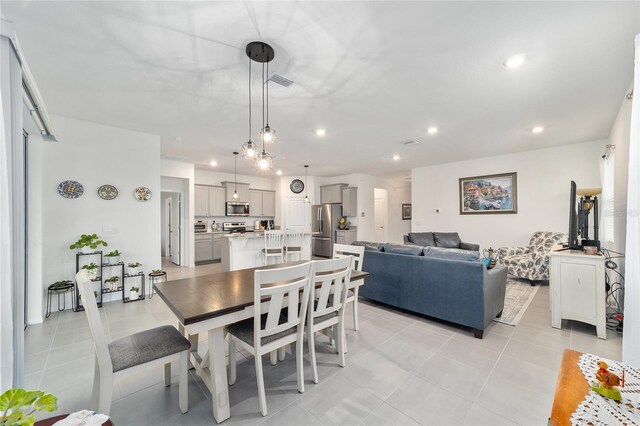 dining room featuring light tile patterned flooring