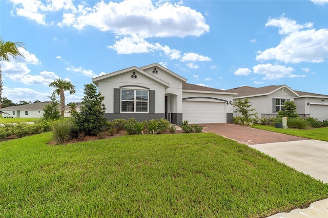 ranch-style house featuring a garage and a front lawn